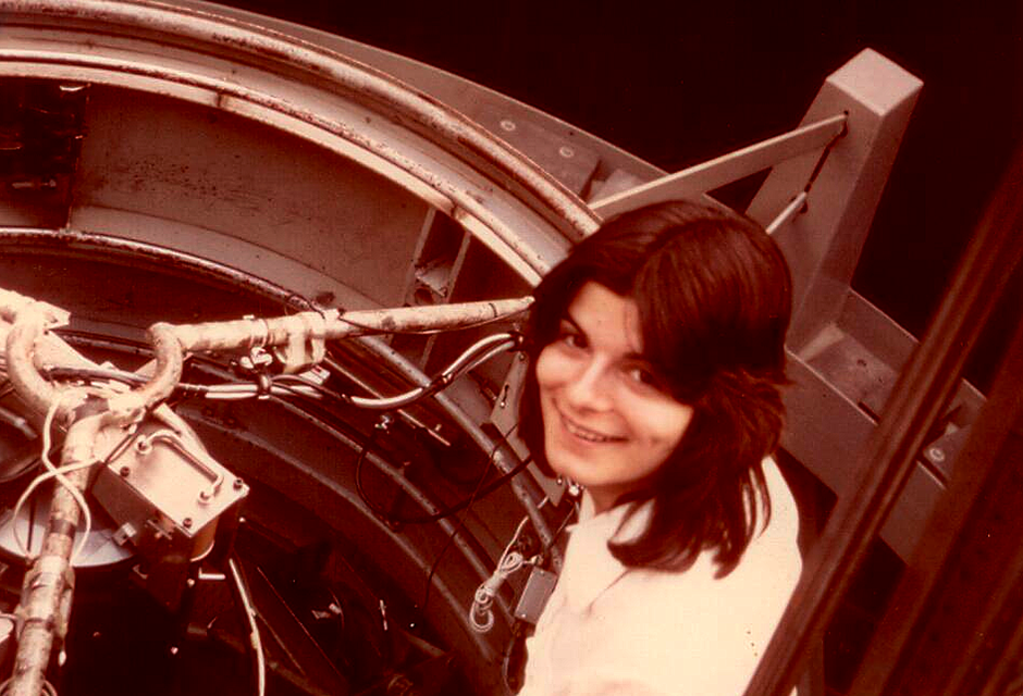 Young Carolyn Porco with telescope, 1975