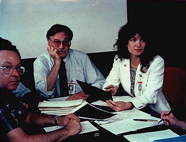 Carolyn Porco meeting with Voyager imaging team leader Brad Smith and others prior to a Voyager-Neptune encounter press conference, 1989