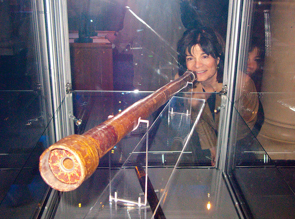 Carolyn Porco checking out one of Galileo's telescopes in Stockholm, Sweden, 2009