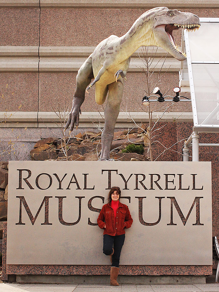 Carolyn Porco with dinosaur friend at the Royal Tyrrell Museum, 2014.